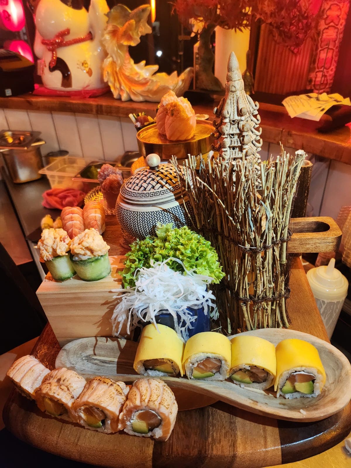 Chef torching nigiri over charcoal
